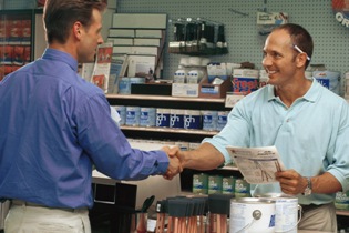 Small business owner assisting customer image